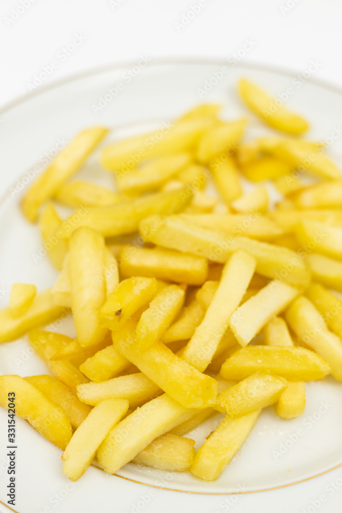 French Fries served on the white plate French Fries served on the white plate