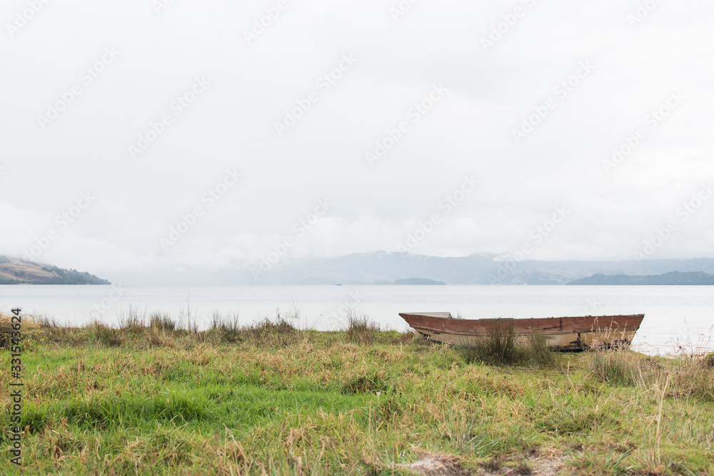 Boat on the shore of Tota, the largest lake in Colombia Boat on the shore of Tota, the largest lake in Colombia