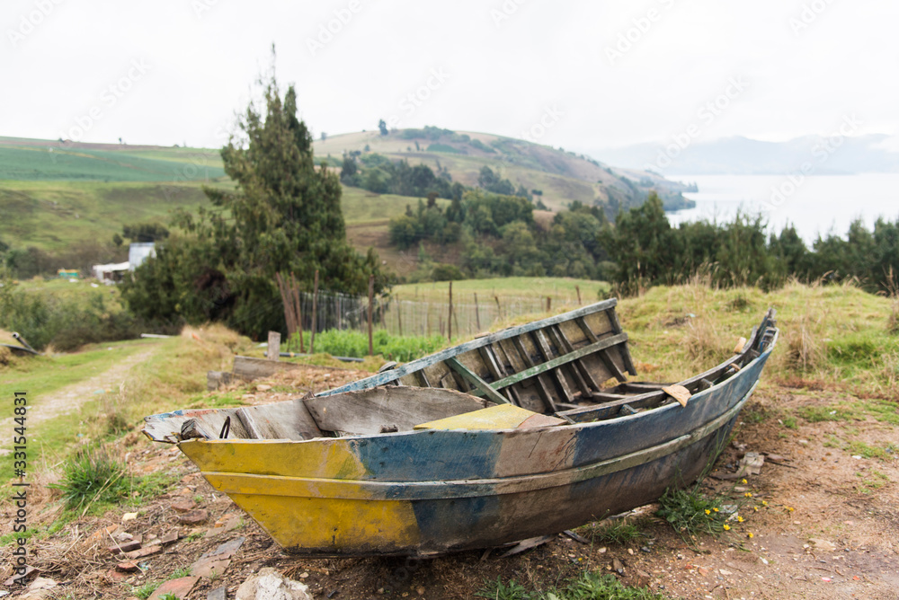 Old broken boat on the shore of Tota, the largest Colombian lake