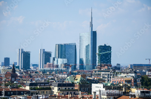 Milan cityscape at summer day with new modern skyscrapers of Porta Nuova business district from Duomo roof terrace in Italy © Dmytro