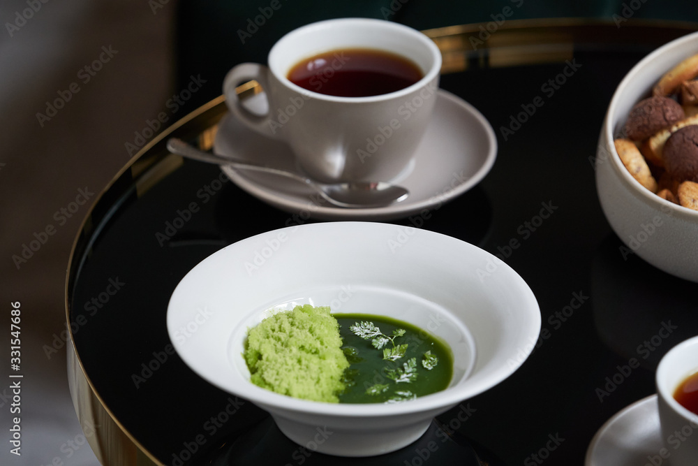 Afternoon tea with cake on restaurant table, close-up. Afternoon tea with cake on restaurant table, close-up.