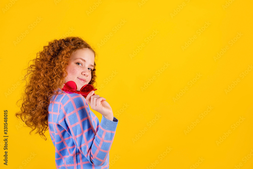 red haired , emotional girl with red glasses on a yellow background red haired , emotional girl with red glasses on a yellow background