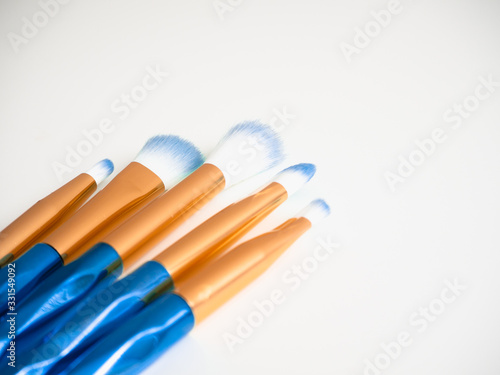 Classic blue eyeshadow brushes isolated on white background with space for copy space.