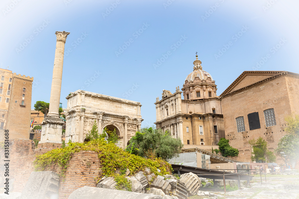  triumphal arch of Septimius Severus (Arco di Settimio Severo) and the Santi Luca e Martina church in the Roman Forum, Rome, Lazio, Italy