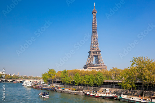 Paris with Eiffel Tower against boats during spring time in France © Tomas Marek