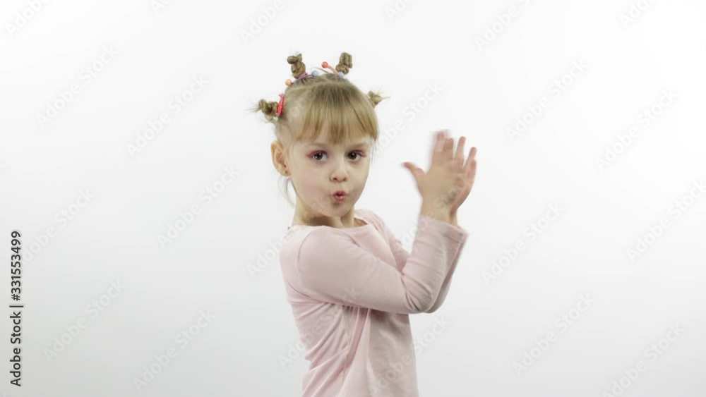 Positive girl in pink blouse dancing. Happy four little child. White background Positive girl in pink blouse dancing. Happy four little child. White background