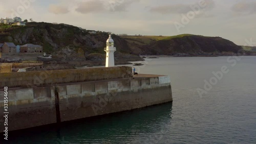 A Lighthouse on the Breakwater of Mevagissey in Cornwall UK photo