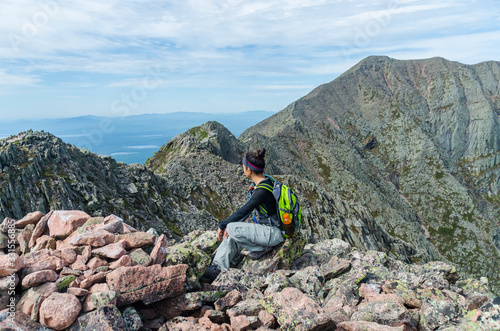 Woman hiking along Knife Edge Trail of Mount Katahdin Northeast Piscataquis Maine USA