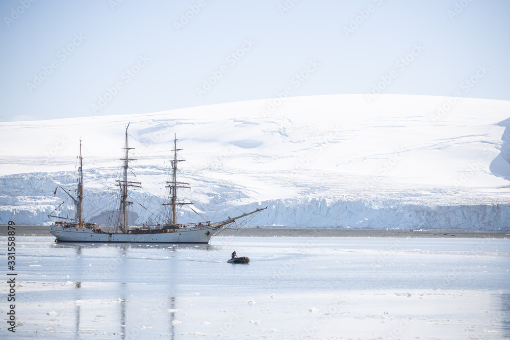 old sailing ship in the bay - whale Harbour half moon Island antarcitca old sailing ship in the bay - whale Harbour half moon Island antarcitca