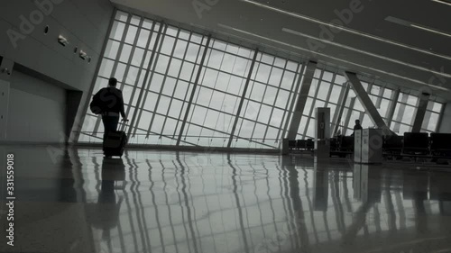 Man is walking in an empty airport 4K
