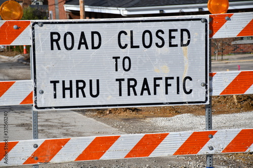 фотографія Road Closed Sign on a Road Barrier