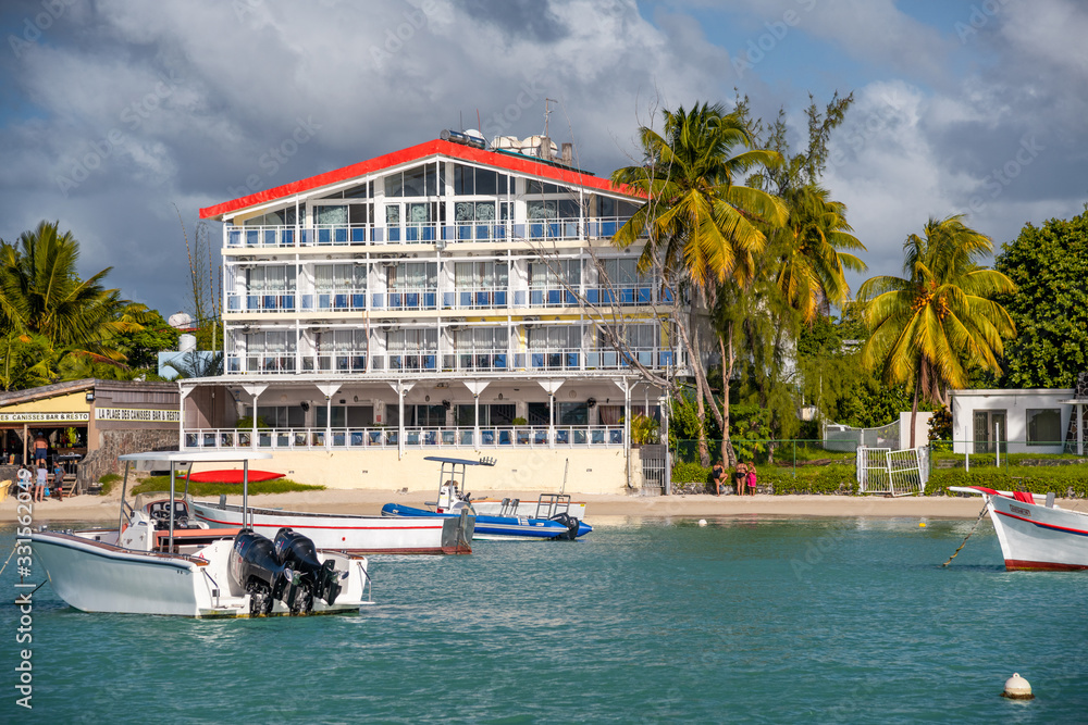 MAURITIUS - MAY 2019: Grand Bay beach with homes and boats