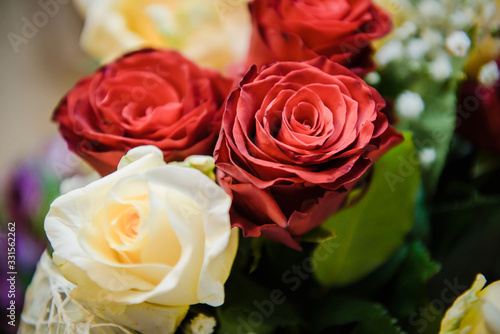 Fresh  lush bouquet of colorful flowers for present close-up photo. Wedding bouquet  red and yellow roses