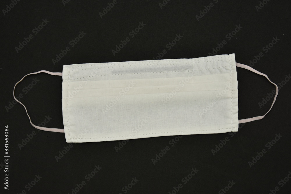 Fototapeta premium Homemade White Cotton Face Mask ,Coronavirus mask ,COVID-19