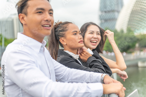 Photography Three asian young friends enjoy outdoor time in the city