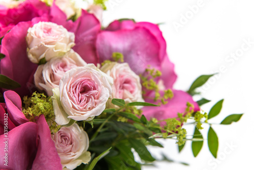 Fresh, lush bouquet of colorful flowers for present. Wedding bouquet of pink roses and freesia flowers. Macro, close-up © Georgiy