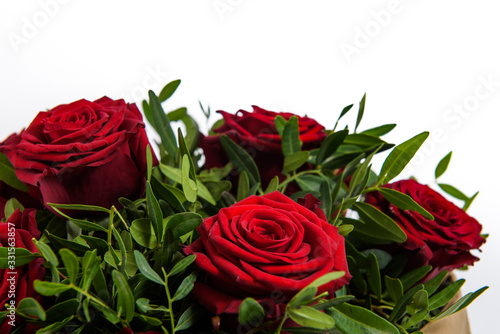 Fresh  lush bouquet of colorful flowers for present.  Wedding bouquet of red roses and freesia flowers. Close-up  macro