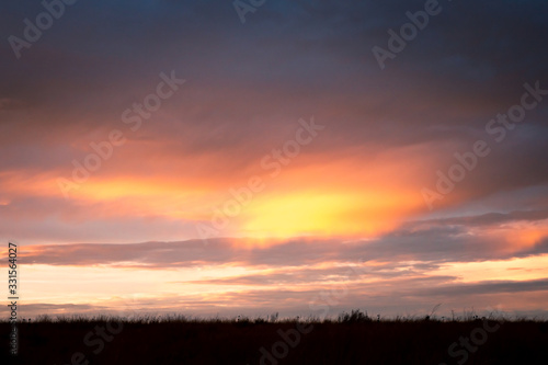 Beautiful sunset sky with green glass