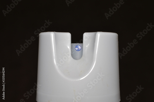 Wallpaper Mural hand getting ready to spray a cleaning agent on dark background Torontodigital.ca