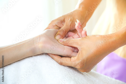 Female hand massage with pressure point massage