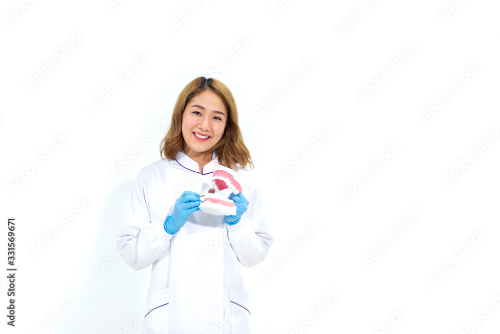 Dentist demonstrating Check the teeth.Dentist patient smiling with holding a plastic denture in a box. Dentist demonstrating Check the teeth.Dentist patient smiling with holding a plastic denture in a box.