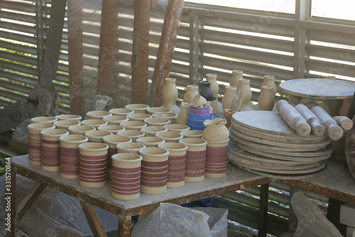 Selective focus of Handmade traditional Malay craft known as 'labu sayong'.It is a hand made water storage container. Clay pottery arts. photo