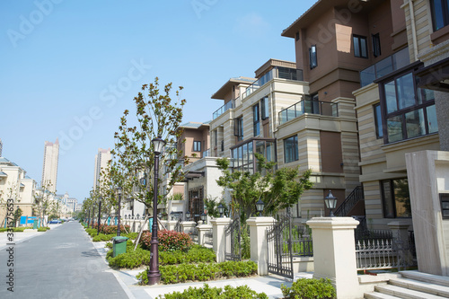 Photography Townhouses under blue sky and white clouds