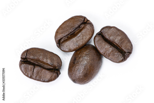 Dark brown coffee bean isolated on white background. Top view
