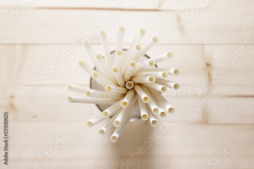 white paper straws in glass, Sustainable lifestyle concept photo