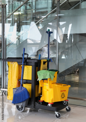 Closeup of janitorial, cleaning equipment and tools for floor cleaning. Vertical view.