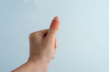 Wounded finger on white background.