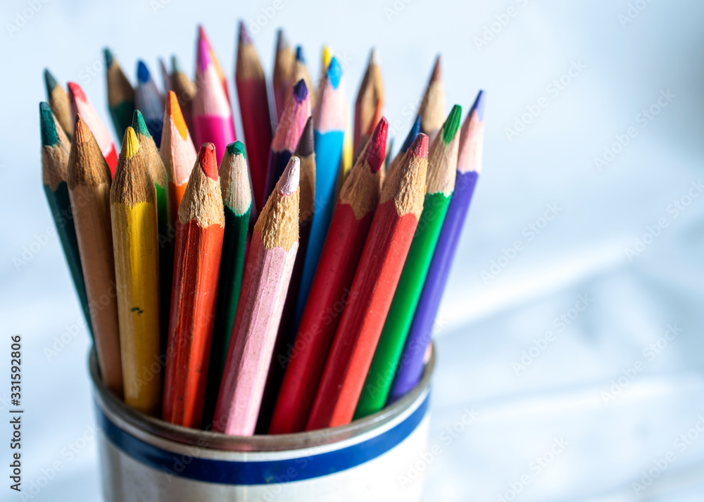 A set of colored pencils on a white background. A set of colored pencils on a white background.