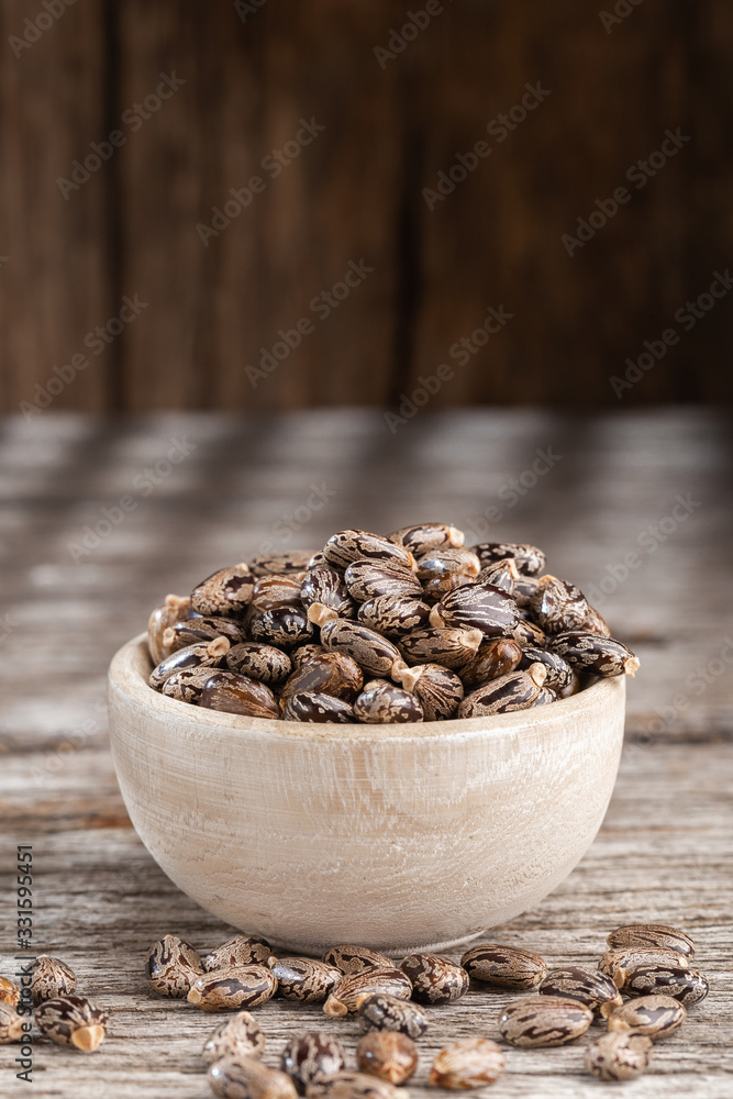 Castor oil seeds on the table, space for text Castor oil seeds on the table, space for text