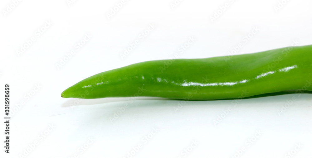 bunch of fresh green chili peppers on a white background bunch of fresh green chili peppers on a white background