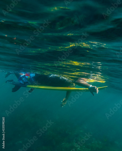 Underwater view of male surfer