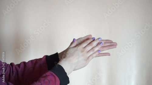 the girl wipes her hands with a napkin
