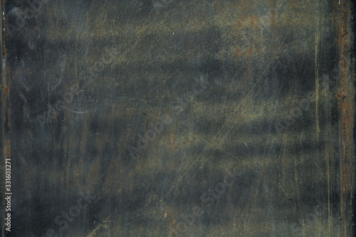 Photos weathered rustic black metal steel door with patina look, grunge and dark backgr
