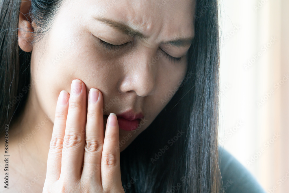Beautiful woman with suffering from toothache, tooth decay or sensitivity. Women healthcare concept