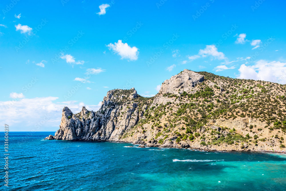 Bay with low mountains and turquoise sea