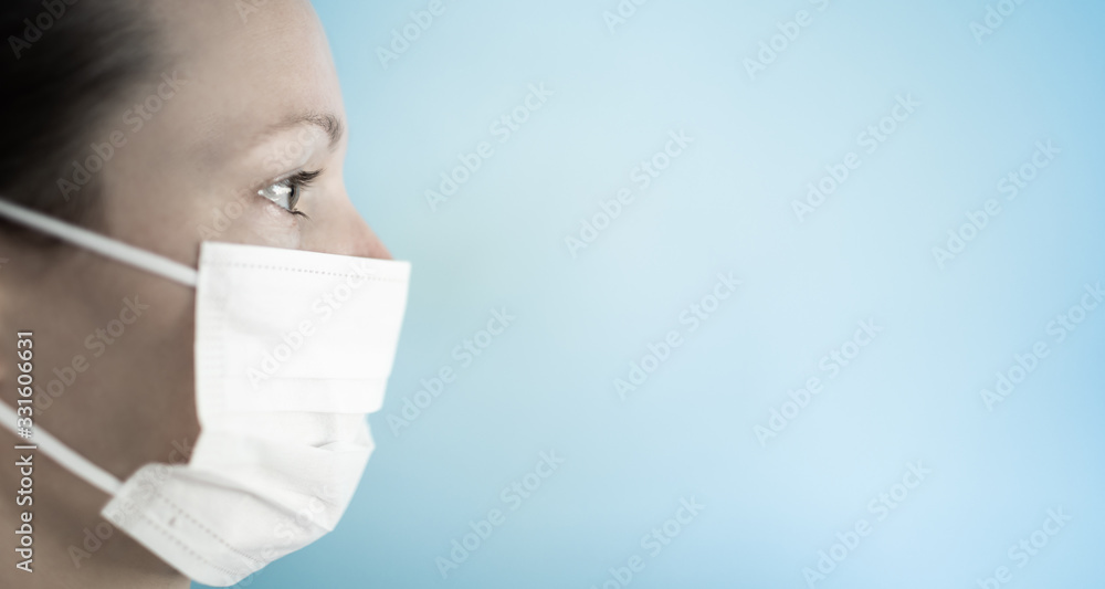 Woman wearing protective face mask isolated on blue background. Woman wearing protective face mask isolated on blue background.