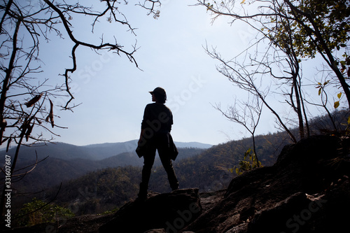 silhouette of a woman on a mountain © lunatic67