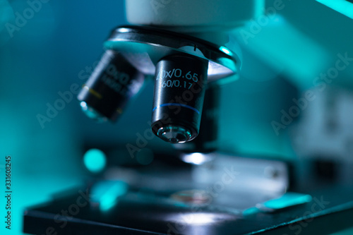 Close-up of scientific microscope. Laboratory in hospital. Epidemic disease, healthcare, vaccine research and coronavirus 2019-ncov test.