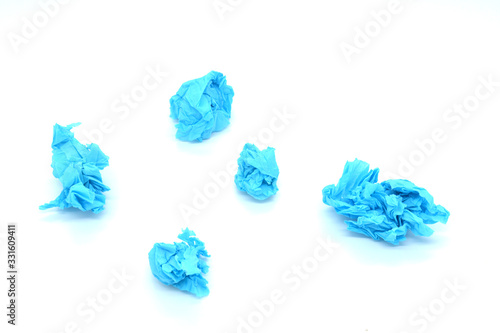 crumpled blue paper isolated on white background, snowball concept, creative crisis, business crisis © Alena