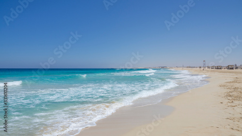 Marsa Matruh, Egypt. The sandy beach and the amazing sea with tropical blue, turquoise and green colors. Relaxing context. Fabulous holidays. Mediterranean Sea. North Africa. Clean and pristine sea