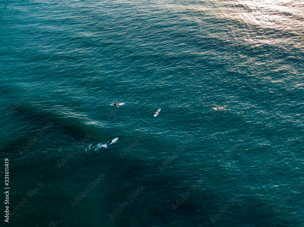 Beautiful aerial view Surfers in the Beach town of Jaco in Costa Rica