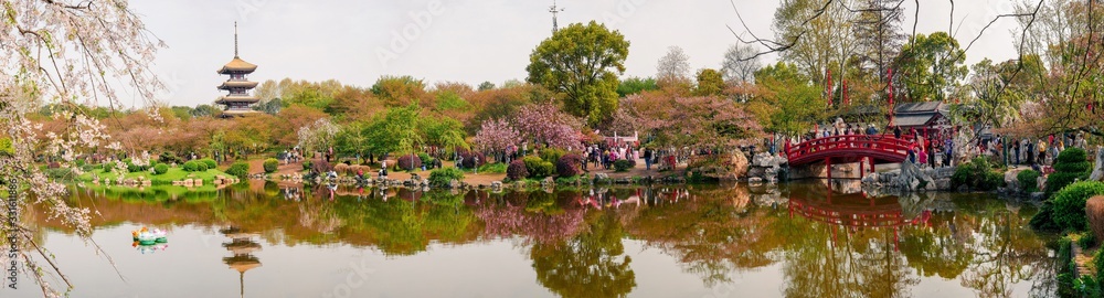 HUBEI,CHINA 3 april 2019 - people walk in ancient tower of Donghu(East lake) Moshan cherry garden,Wuhan