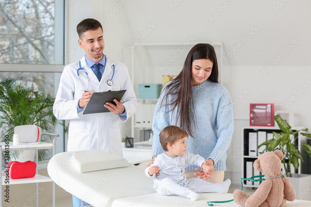 Fototapeta premium Woman with little baby visiting pediatrician in clinic