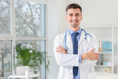 Handsome male doctor in clinic