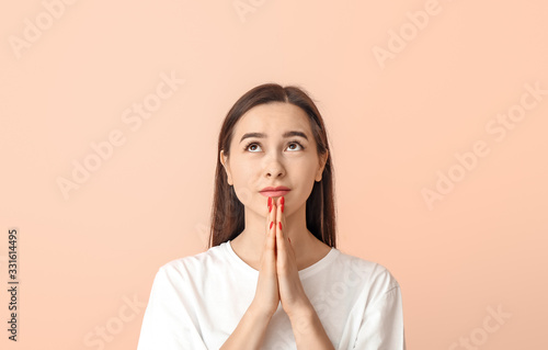Portrait of praying young w...