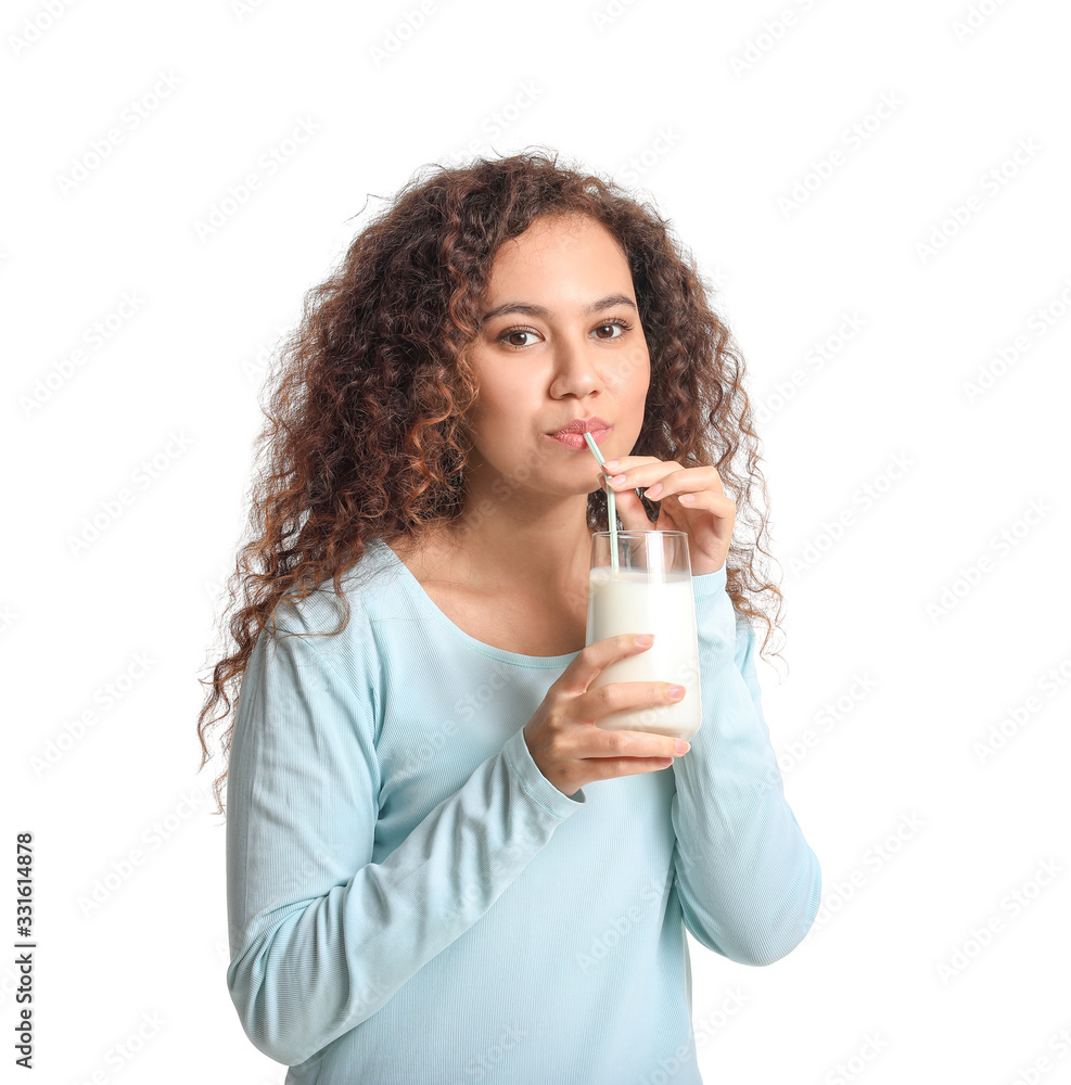 Young African-American woman with milk on white background Young African-American woman with milk on white background